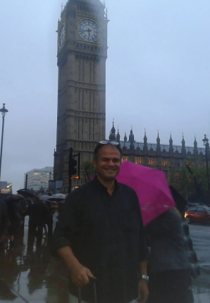 Hatim Elafifi by Big Ben on a rainy evening